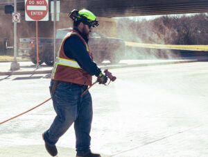 Denton Hazmat Cleanup North Texas Spill Response Technician Cleaning Pavement
